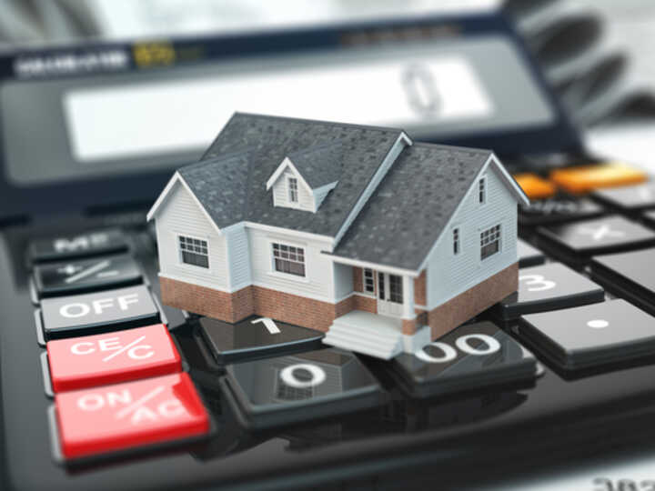 Model of a house on top of a calculator