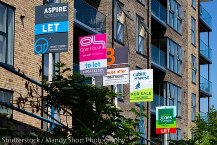 For Sale and To Let signs outside a block of flats