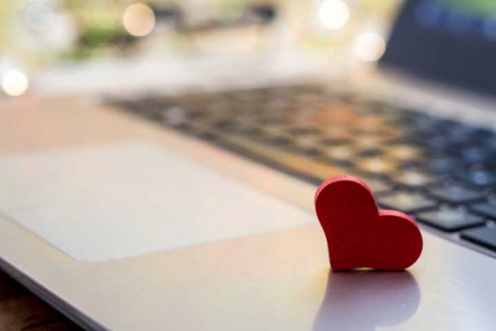 Laptop with a red heart cutout