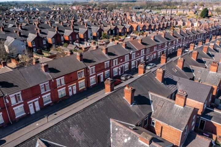 An aerial view above the rooftops of terraced houses in northern England