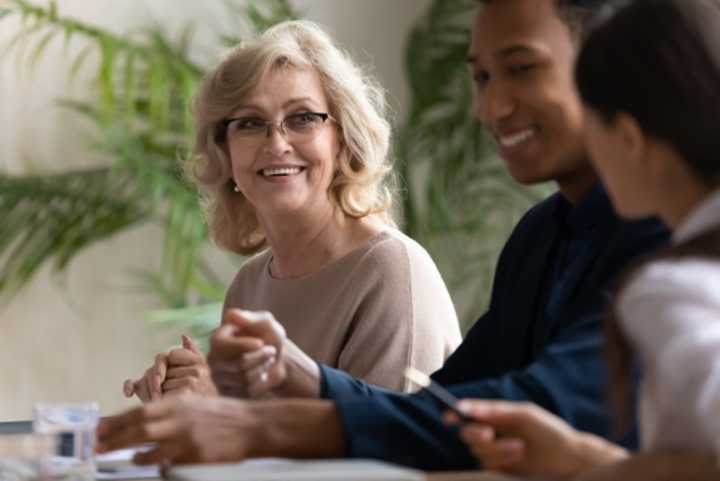 Three employees sitting together in the office