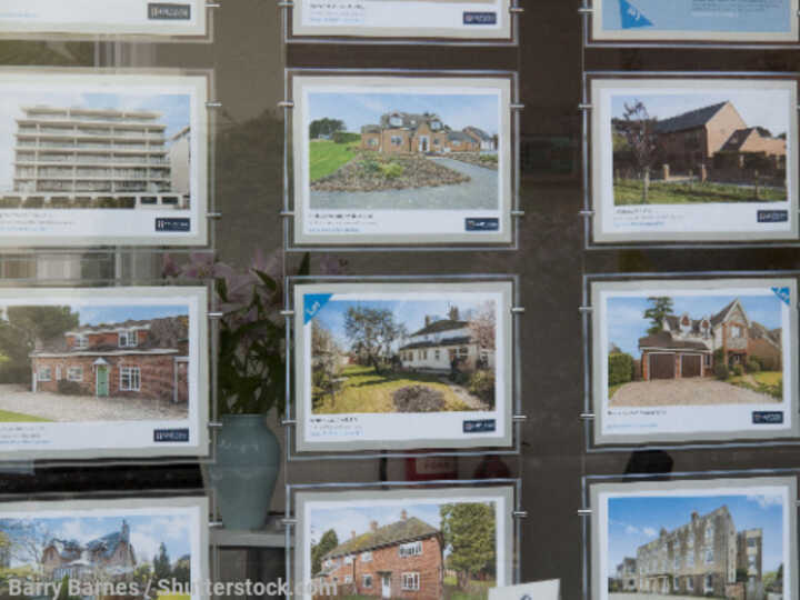 Homes for sale in an estate agent's window