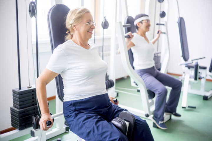 Older women using gym equipment